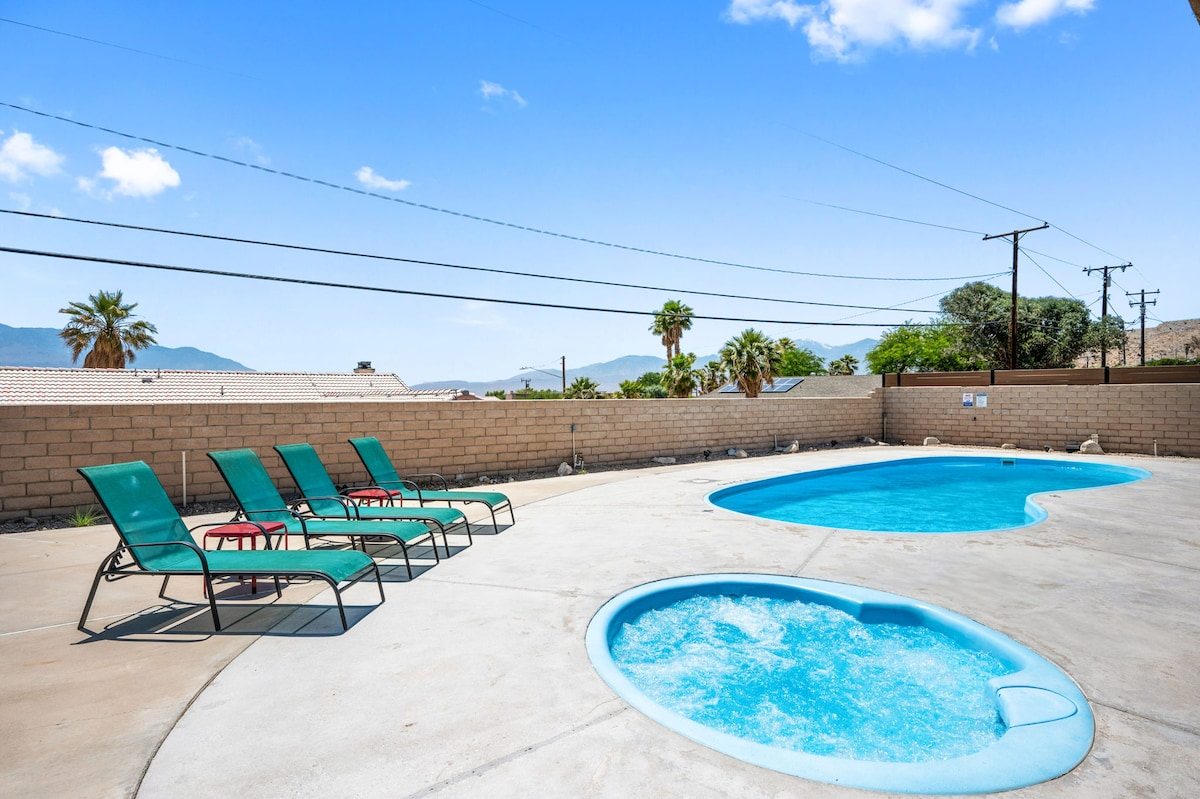 Private hot tub heated to 104 degrees, bubbling beside the pool